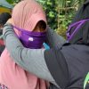 Axis dan ACT membagikan masker di Padang dan Medan.