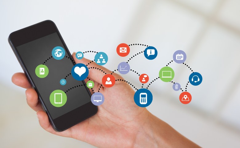 composite image of hand holding smartphone with smartphone icons